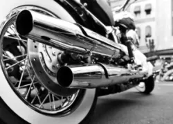 A close-up photo of a motorcycle’s double exhaust pipes.