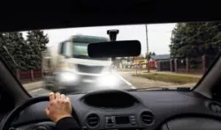 Moment before a frontal collision between a truck and a passenger vehicle. A truck accident lawyer in Covina can help you get maximum compensation