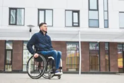 A man in a wheelchair is going to a meeting with a catastrophic injury lawyer in Sacramento.