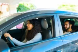 A man using a rideshare service. In the event of a crash, you can work with a San Diego rideshare accident lawyer.