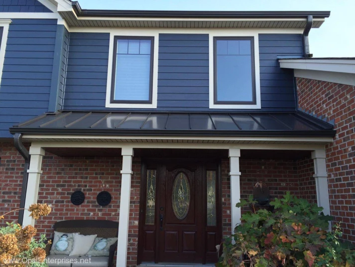 Deep Ocean James Hardie Siding paired with brick & Andersen Windows