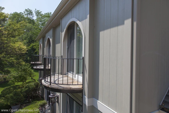 Home with vertical siding Hardie fiber cement panels and Andersen patio doors