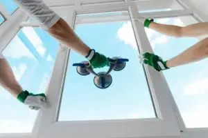 Installing a window with a vacuum sealer.