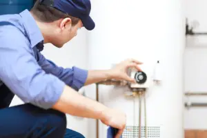 repairman handling water heater