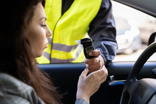 A woman getting pulled over wonders, “How do I get a DUI dismissed in Washington State?”