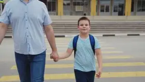 father-and-son-crossing-the-road-as-pedestrians