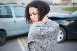woman-holding-her-neck-after-an-auto-accident