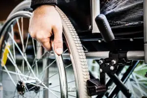 hand-on-wheelchair-wheel