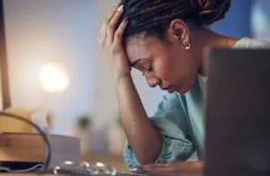 sad black woman suffering from emotional distress