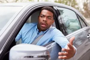 Frustrated driver sitting in car