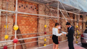 Construction workers discussing a project completion