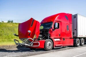 A red truck after an accident. How will a truck accident lawyer help me?