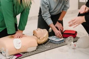 Doctors using an AED defibrillator on a test dummy. How long do I have to file an AED defibrillator claim.