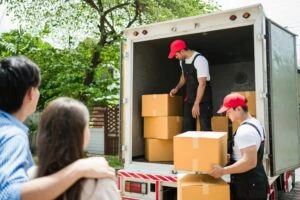 Moving truck with movers removing boxes. What to do if I’m in an accident with a moving truck.