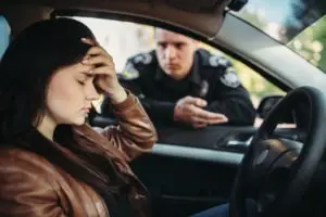 cop pulling over distraught woman