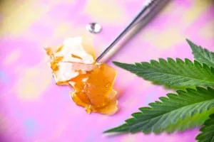 cannabis concentrate and marijuana leaf