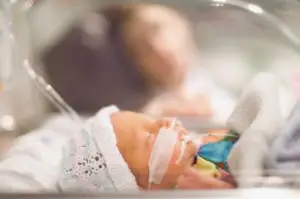 a baby in the neonatal intensive care unit of a hospital