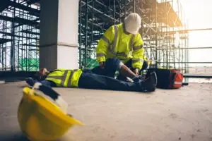 an injured construction worker being attended to at a worksite