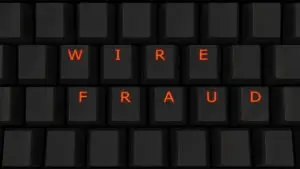 the words wire fraud on a keyboard