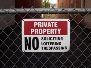 private property sign on chain-link fence