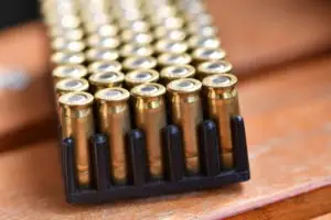 Pistol ammo is stored on top of a table.