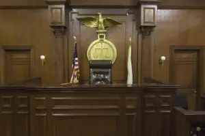 the chair of a judge in an empty courtroom