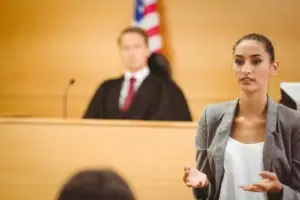 A lawyer makes her closing statement in court.