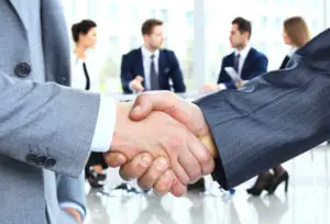 business people shaking hands at meeting