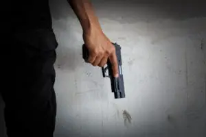 closeup of a person holding a gun
