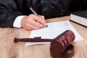 a judge signing a court order