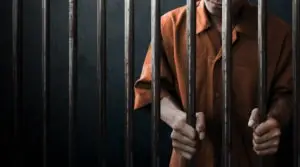 a prisoner in a jail cell
