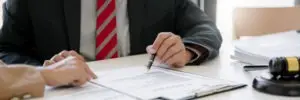 defense lawyer does paperwork with client