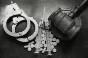 gavel, handcuffs and drugs