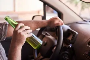 man drinking while driving