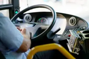 bus driver behind the wheel