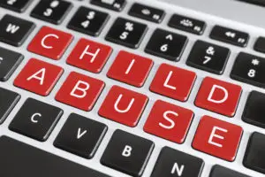child abuse spelled on keyboard
