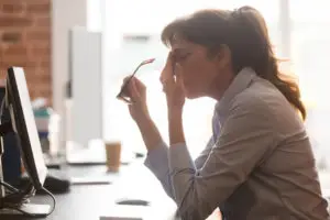 female office worker with a headache