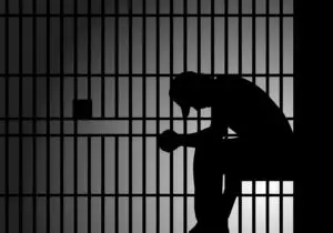 inmate behind bars