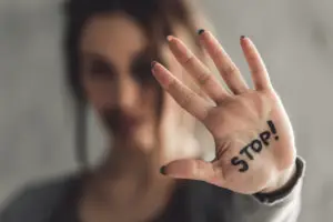 woman with stop on her hand