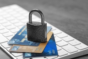 credit cards and lock on computer keyboard