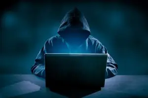 hacker using laptop hacking internet