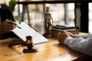 lawyer asking client to sign a contract
