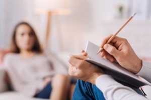 woman talking to therapist