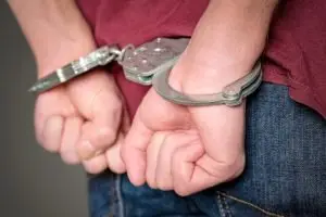 close-up on man in handcuffs