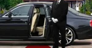 limo driver waiting to help a passenger into the car