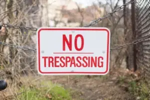 no trespassing sign on a chain