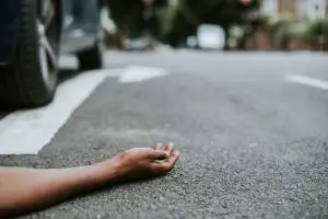person lying in the street