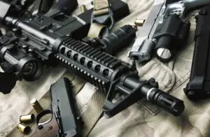 pile of assault rifles