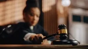 female judge banging gavel