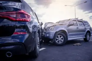 SUVs in a crash on the road